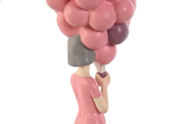 Figura niña con globos